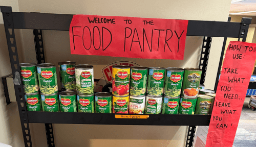 Food Pantry with a sign: How to use: take what you need...leave what you can!